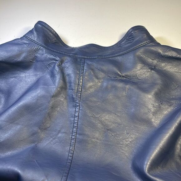 Navy blue, purple is some light. flawed item. Please see picture of spot on neck - Picture 7 of 7